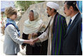 Mrs. Laura Bush meets with local leaders as she arrives June 9, 2008 at the Bamiyan Bazaar in Afghanistan to inaugerate work on the road project.