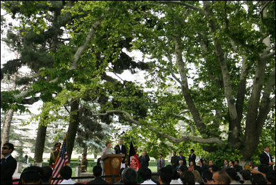 Under the boughs of the trees of Gul Khana Palace, Mrs. Laura Bush delivers remarks Sunday, June 8, 2008, during a press availability with President Hamid Karzai of Afghanistan in Kabul.