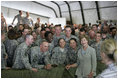 Mrs. Laura Bush poses for a photo with US troops during her visit to Bagram Air Force Base Sunday, June 8, 2008, in Bagram, Afghanistan.