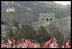 The President and Mrs. Bush pose with a group of Chinese children at the Great Wall of China in Badaling about an hour outside of Beijing, Friday, February 22, 2002. The children waved flags and sang for the Bushes.