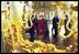 Laura Bush and Ludmila Putin, wife of Russian President Valdimir Putin, are reflected in a gilded mirror as they walk through one of the great halls of Catherine's Palace outside St. Petersburg, Russia.