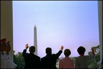 The two leaders and their wives wave to one of the most crowded State Arrival Ceremonies in recent memory. "Today, Laura and I are honored to welcome the President (President Kwasniewski) and the First Lady to an America that is proud to call Poland friend and ally, and a partner," said President Bush.