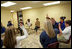 Laura Bush and U.S. Secretary of Education Margaret Spellings meet with staff and students Wednesday, Jan. 26, 2006 at the St. Bernard Unified School in Chalmette, La. Students raise their hands to acknowledge that their families lost everything in the storms of Hurricane Katrina.