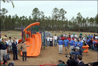 Laura Bush addresses a gathering to dedicate the new Kaboom Playground, built at the Hancock North Central Elementary School in Kiln, Ms., Wednesday, Jan. 26, 2006, during a visit to the area ravaged by Hurricane Katrina.