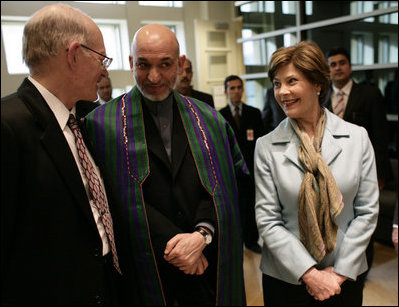 Mrs. Laura Bush and U.S Ambassador to Afghanistan Ronald E. Neumann speak with Afghanistan President Hamid Karzai, Wednesday, March 1, 2006, during the official dedication of the new U.S. Embassy building in Kabul, Afghanistan.