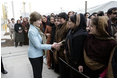 Mrs. Laura Bush greets a welcoming delegation of women, Wednesday, March 1, 2006, at the dedication of the new U.S. Embassy Building in Kabul, Afghanistan.