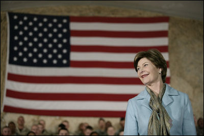 Mrs.Laura Bush appears before an audience of U.S. and Coalition troops, Wednesday, March 1, 2006, during a visit to Bagram Air Base in Afghanistan, where President George W. Bush thanked the troops for their service in defense of freedom.