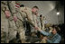 Mrs. Laura Bush greets U.S. and Coalition troops Wednesday, March 1, 2006, during a stopover at Bagram Air Base in Afghanistan, prior to the President and Mrs. Bush visiting India and Pakistan.