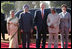 President George W. Bush and Laura Bush are greeted upon their arrival at Rashtrapati Bhavan, New Delhi, India, by India President A.P.J. Abdul Kalam; Prime Minister Manmohan Singh and his wife, Gursharan Kaur.