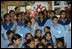 Mrs. Laura Bush poses for photos with teachers and students on her tour of Prayas, Thursday, March 2, 2006, in New Delhi, India.