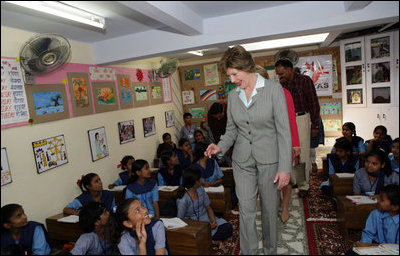 Mrs. Laura Bush meets and waves to children during her tour of Prayas, Thursday, March 2, 2006, in New Delhi, India.