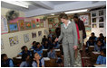 Mrs. Laura Bush meets and waves to children during her tour of Prayas, Thursday, March 2, 2006, in New Delhi, India.