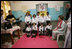 Mrs. Laura Bush listens to a children's choir, Thursday, March 2, 2006, during her visit to Mother Teresa's Jeevan Jyoti (Light of Life) Home for Disabled Children in New Delhi, India.