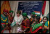 Mrs. Laura Bush plays a tambourine presented to her by the Nrityanjali Academy performers Friday, March 3, 2006 during her participation in an HIV/AIDS prevention event in Hyderabad, India.