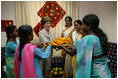 Mrs. Laura Bush is presented with gifts on her visit to an HIV/AIDS education prevention and treatment facility, Friday, March 3, 2006 at the Acharya N.G. Ranga Agricultural University in Hyderabad, India.