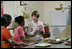 Mrs. Laura Bush visits a Home Science School Lab, Friday, March 3, 2006 at the Acharya N.G. Ranga Agricultural University in Hyderabad, India, viewing a demonstration on making guava cheese.