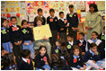 Mrs. Laura Bush reads to children at the Children's Resources International clasroom at the U.S. Embassy, Saturday, March 4, 2006 in Islamabad, Pakistan.