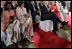 Laura Bush sits with Secretary of State Condoleezza Rice as they listen to President Bush's remarks Friday evening, March 3, 2006, in New Delhi.