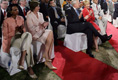 Laura Bush sits with Secretary of State Condoleezza Rice as they listen to President Bush's remarks Friday evening, March 3, 2006, in New Delhi.