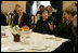 Mrs. Laura Bush listens as she participates in a briefing presented by the USUN Mission and World Food Program, Thursday, Feb. 9, 2006 in Rome, regarding hunger and AIDS issues. One of the purposes of the U.S. Mission to the UN agencies for Food and Agriculture is to draw attention to the global problems of hunger and food security. Ambassador Ronald Spogli, U.S. Ambassador to Italy, is seen at left.