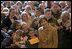 Mrs. Laura Bush meets children and poses for photos during her visit to Aviano AIr Base in Aviano, Italy, Friday, Feb. 10, 2006.