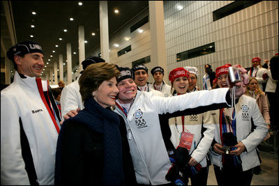 Laura Bush poses for photos with 2006 U.S. Winter Olympic athletes in Turin, Italy, Friday, Feb. 10, 2006 before the Opening Ceremony.