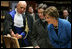 Laura Bush looks at an Ancient Thesis of Montichelli during a tour given by Paolo Novaria, Archives, left, at the University of Turin Saturday, Feb. 11, 2006, in Turin, Italy.