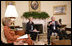 President George W. Bush, seen with U.S. Secretary of Education Margaret Spellings, center, and Laura Bush, left,  gestures as he speaks with reporters, Tuesday, Sept. 6, 2005 in the Oval Office at the White House, about efforts the Department of Education is undertaking with a program, "Hurricane Help for Schools," established to assist schools and students affected by Hurricane Katrina.