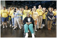 "Operation Compassion" volunteers wave to First Lady Laura Bush Monday, Sept. 19, 2005, as she visited Houston's George R. Brown Convention Center. The Convention Center was designated a shelter for Hurricane Katrina evacuees and since opening its doors Sept. 2, more than 35,000 have been served and approximately 46,000 volunteers have been trained.