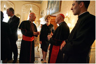 Laura Bush talks with American cardinals, archbishops and bishops during a reception at the Villa Taverna in Rome April 7, 2005.