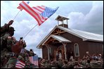 President George W. Bush and Laura Bush greet American troops at Camp Bondsteel in Kosovo Saturday, July 24, 2001. White House photo by Eric Draper.