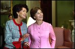 Mrs. Jolanta Kwasniewska, First Lady of Poland, and Laura Bush look at art in the Green Room during the State Visit honoring Poland Wednesday, July 17, 2002. White House photo by Susan Sterner.