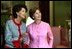 Mrs. Jolanta Kwasniewska, First Lady of Poland, and Laura Bush look at art in the Green Room during the State Visit honoring Poland Wednesday, July 17, 2002. White House photo by Susan Sterner.