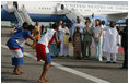 Mrs. Laura Bush and her daughter Barbara Bush are greeted by a cultural dance troupe upon their arrival Sunday, Jan. 15, 2006 at Kotoka International Airport in Accra, Ghana. White House photo by Shealah Craighead