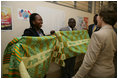 Mrs. Bush admires the decorative welcoming banner as she arrives to visit the Korle-Bu Treament Center, Tuesday, Jan. 17, 2006 in Accra, Ghana.