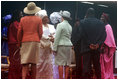 Mrs. Laura Bush, center, and U.S. Secretary of State Condoleezza Rice, left-foreground, congratulate Liberian President Ellen Johnson Sirleaf in Monrovia, Liberia, at her inauguration Monday, Jan. 16, 2006. President Sirleaf is Africa's first female elected head of state.