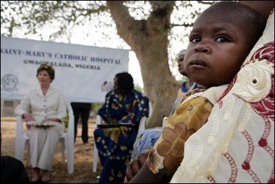 Mrs. Bush sits outside at Saint-Mary's Catholic Hospital in Gwagwalada, Nigeria Wednesday, Jan. 18, 2006, where she announced a $163 million commitment by the United States to Nigeria to battle AIDS.