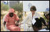 Laura Bush holds hands with patients during a prayer at St. Mary's Hospital in Gwagwalada, Nigeria, Wednesday, Jan. 18, 2006.