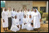 Laura Bush and her daughter Barbara Bush pose for a photo with some of the staff at St. Mary's Hospital, Wednesday, Jan. 18, 2006 in Gwagwalada, Nigeria.