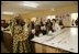 A teacher conducts a lesson at the Model Secondary School during a visit to the school by Laura Bush and her daughter Barbara Bush in Abuja, Nigeria Wednesday, Jan. 18, 2006.