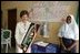 Laura Bush admires a gift presented to her at the conclusion of her visit to the Model Secondary School in Abuja, Nigeria, January 18, 2006.