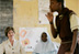 Laura Bush watches a young girl read her poem at the Model Secondary School in Abuja, Nigeria, Wednesday, Jan. 18, 2006.