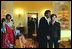 Laura Bush and Jeannette Kagame, First Lady of the Republic of Rwanda, look at the view of Washington, D.C. from the White House's Yellow Oval Room Tuesday, March 4, 2003. White House photo by Susan Sterner.