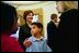 Laura Bush talks with several children of the lost crew members of the Space Shuttle Columbia during their families' visit to the Oval Office Friday, March 7, 2003. From left, they are, Sydney Anderson, 11, David Ramon, 9, and Laura Husband, 12. Their fathers are Lt. Col. Michael Anderson, Col. Ilan Ramon and Col. Rick Husband. White House photo by Eric Draper.