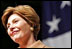 Laura Bush delivers remarks to U.S. soldiers and spouses during a visit to Ramstein Air Base Tuesday, Feb. 22, 2005 in Ramstein, Germany. Mrs. Bush thanked U.S. servicemen and women and the families that support them for their bravery and sacrifice.