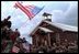 President George W. Bush and Laura Bush greet American troops at Camp Bondsteel in Kosovo Saturday, July 24, 2001.