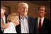 Former President Gerald R. Ford is embraced by his wife Betty Ford at a Gerald R. Foundation dinner in Rancho Mirage, Calif., June 6, 2005.