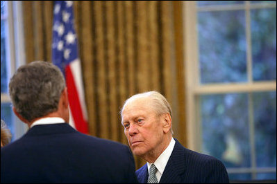 President George W. Bush talks with former President Gerald R. Ford in the Oval Office July 16, 2003. 