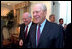 Former President Gerald R. Ford walks with Vice President Dick Cheney at a dinner for the Gerald R. Ford Foundation June 3, 2002. The foundation is a non-profit organization that supports the Gerald R. Ford Library and Museum.