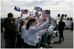 President George W. Bush and Laura Bush are greeted by ceremony and cheers upon their arrival at Glasgow Prestwick International Airport in Scotland July 6, 2005.